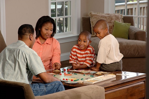 Family playing board game