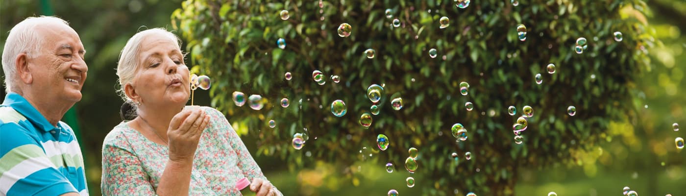 Seniors blowing bubbles